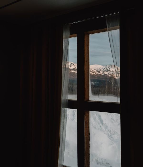 Smiling person feeling energetic and positive outdoors at sunrise.